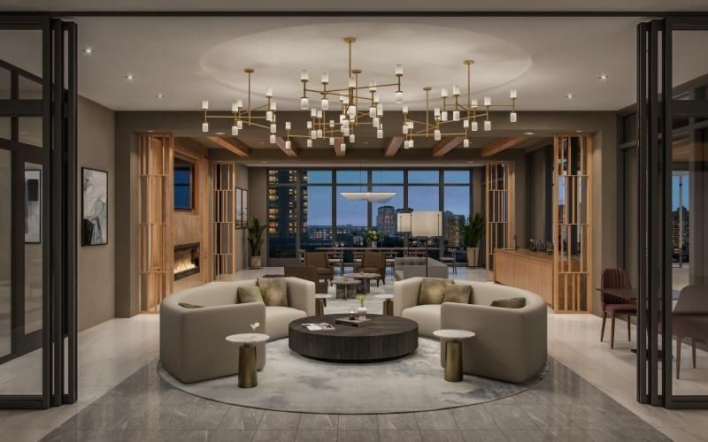 a room with a large glass door and a large white couch