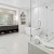 a bathroom with a tub and sink