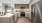 a kitchen with a stainless steel refrigerator