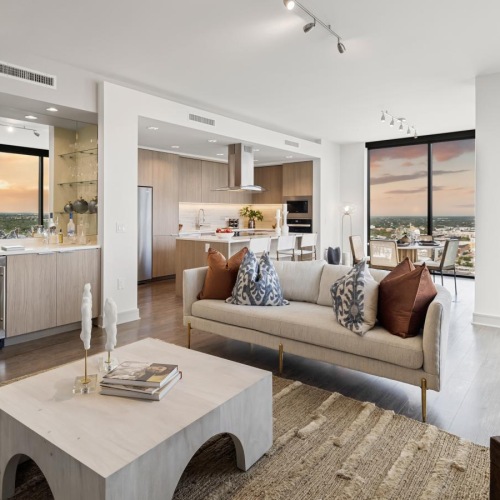 Spacious living areas to recline and recharge a living room with a couch and a table