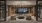 a room with a large glass door and ample lighting
